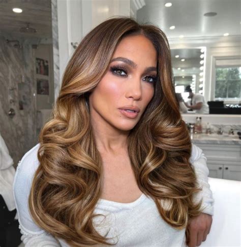 jennifer lopez bun|Jennifer Lopez rocked a sleek 'Tinkerbell' topknot bun.